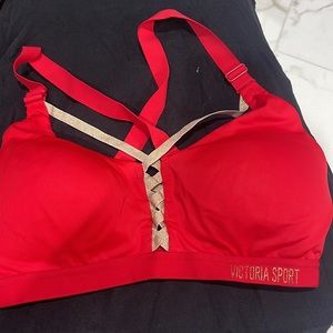 Gymshark sports bra. Like new. Light support. Pink size M. Red and Gold VS 34D.